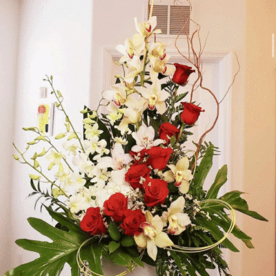 Cymbidium Orchids With Red Roses