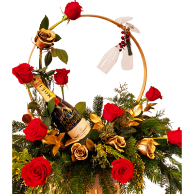 beautiful Christmas arrangement with red bear and a bottle of champagne a special gift for Christmas