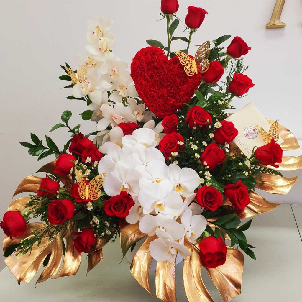 Flower-Extravaganza-Red-Roses-Orchids-Gold-Leaves