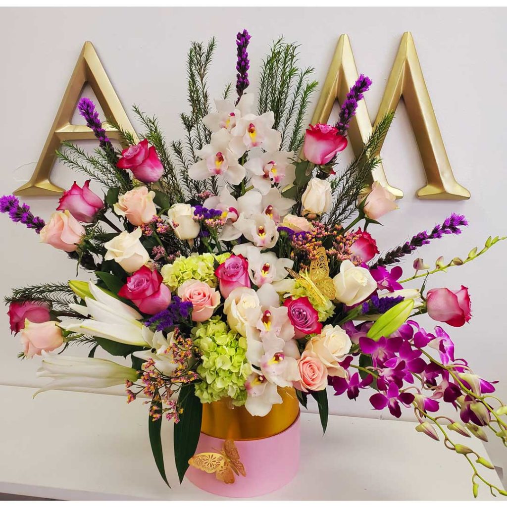 Orchid-Flower-Arrangement-with-pink-purple-and-white-roses