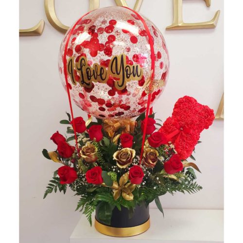 V017 - Take me with you (with a Rose Bear), Flower Arrangement decorated with red and gold roses, a Personalized big I Love You balloon and a small rose bear