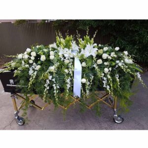 Full Casket Spray feature with roses dendrobium orchids lillies and more