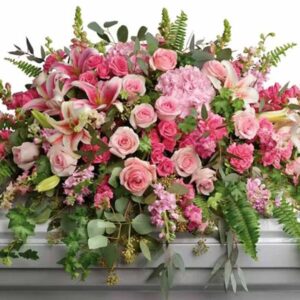 Breathtaking spray of pink hydrangea, roses and lilies. At once dramatic and delicate, it's a feminine reminder of life's greatest love.