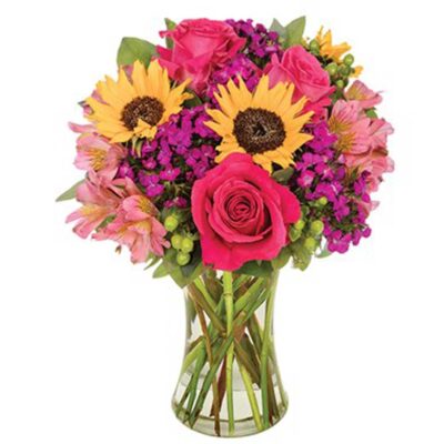 cheerful bouquet features dazzling roses, sunflowers, dianthus, hypericum, alstroemeria, eucalyptus and salal in a clear gathering vase