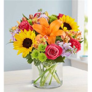 A rich gathering of yellow and orange blooms, with pops of bright pink and purple.