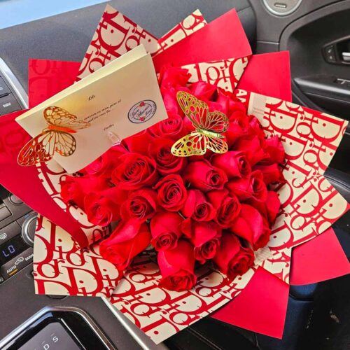 Stunning and Luxurious Red Roses Bouquet wrapped with a beautiful paper